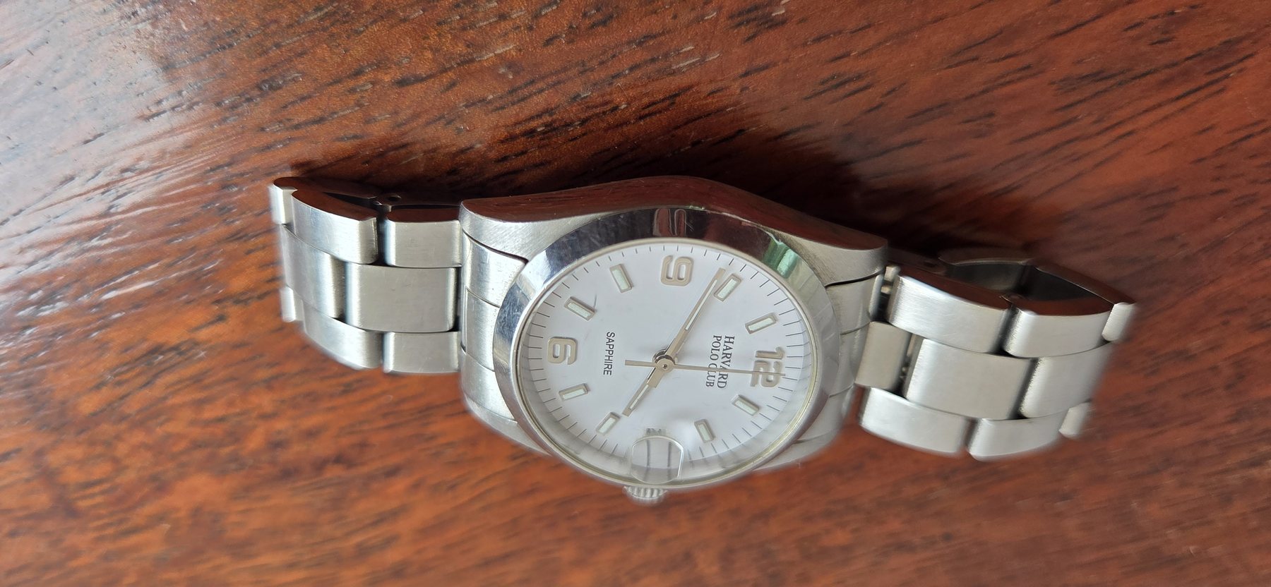 A low three-quarter view showing the case profile and the bracelet.