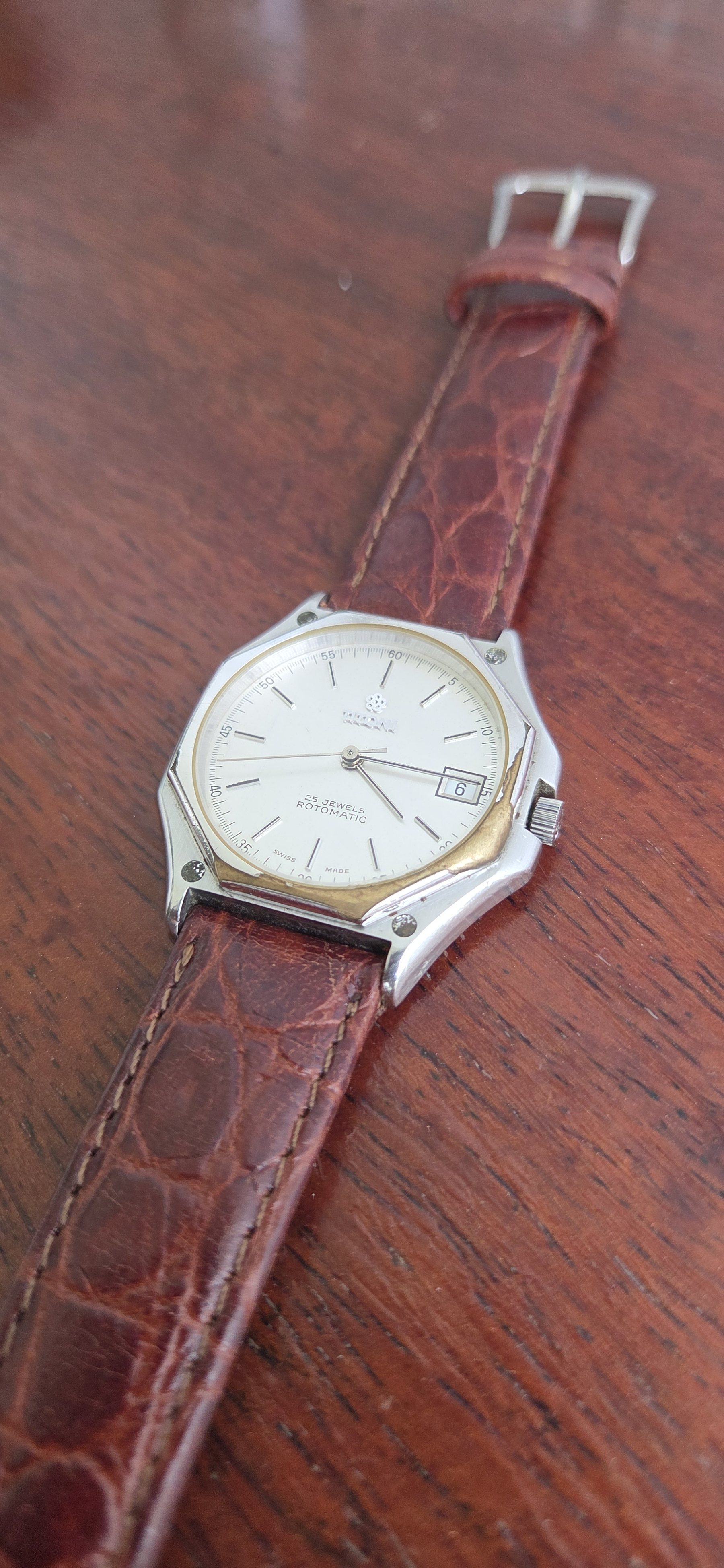 The dial at an angle, the date window clearly visible.
