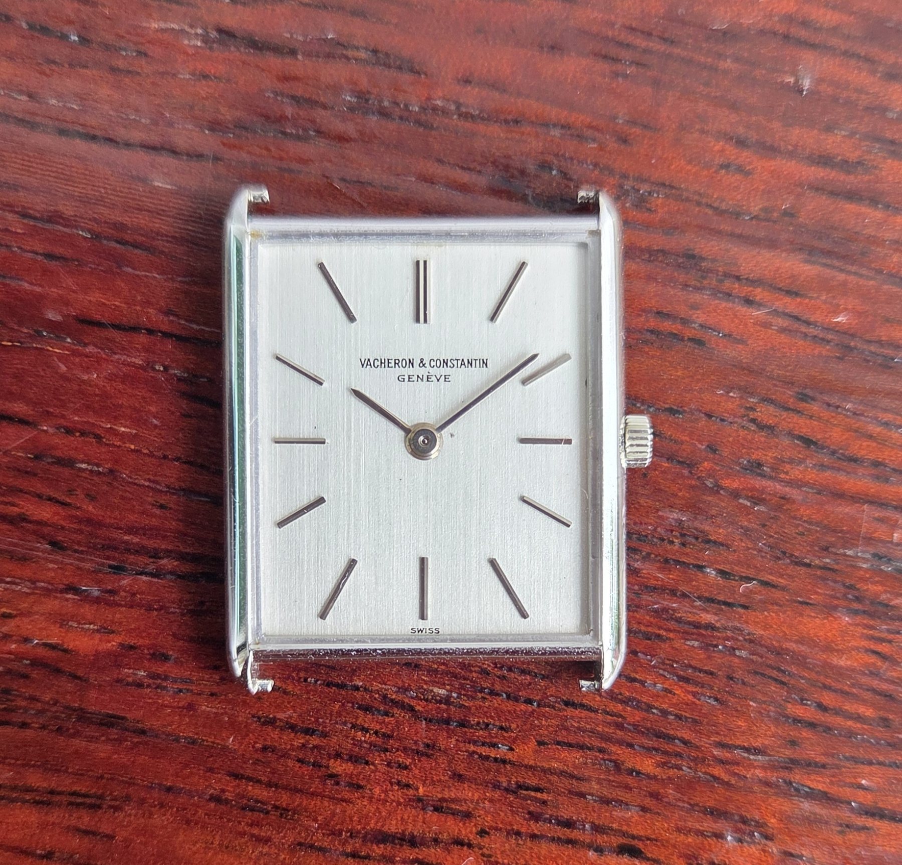 The same dial from slightly above, showing the brushed finish catching the light.