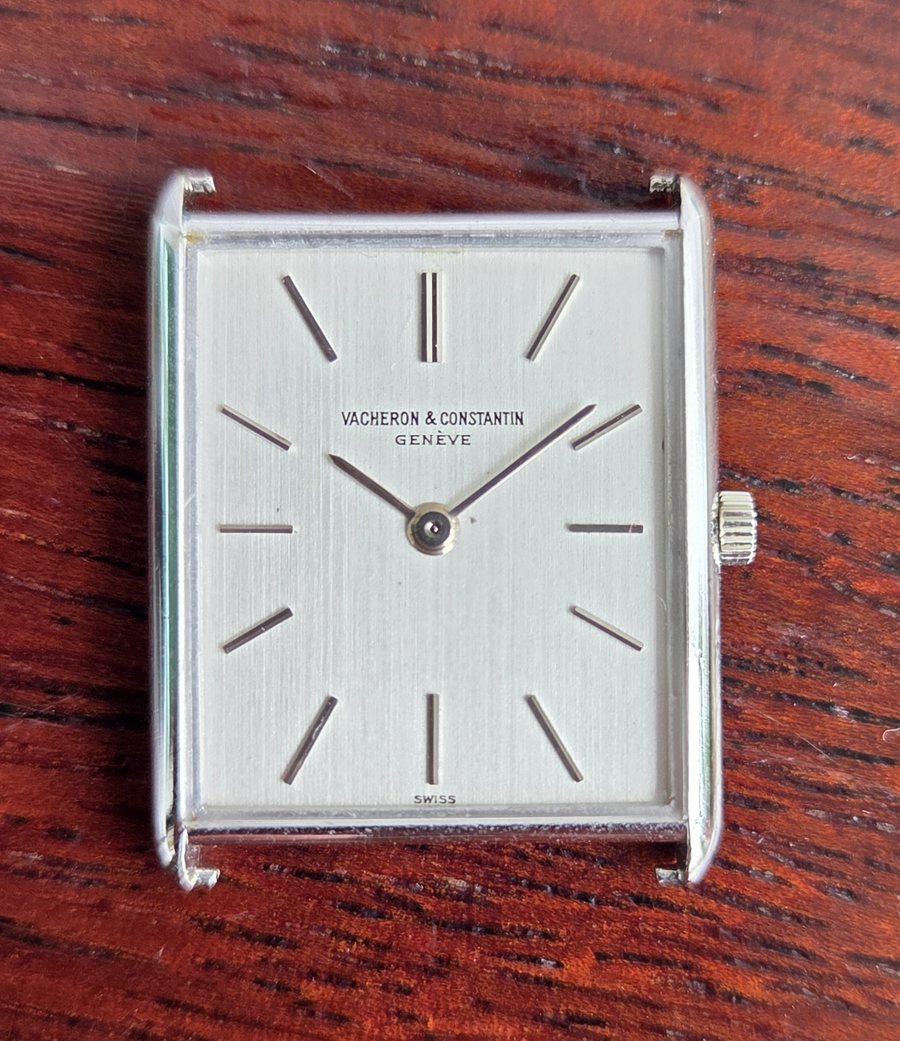 A rectangular Vacheron Constantin, square-on, with a brushed silver dial and applied baton markers.