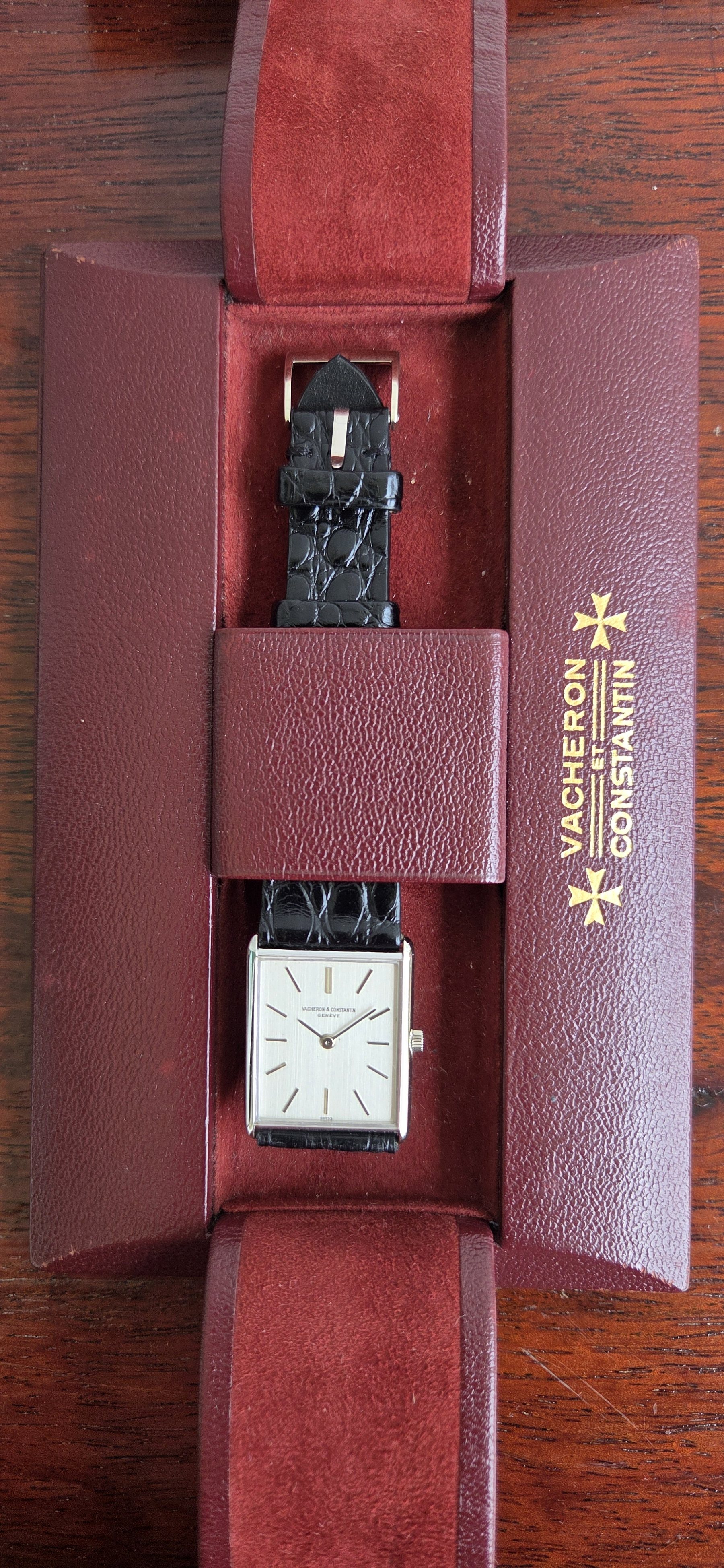 The watch resting inside its original burgundy Vacheron Constantin pouch.